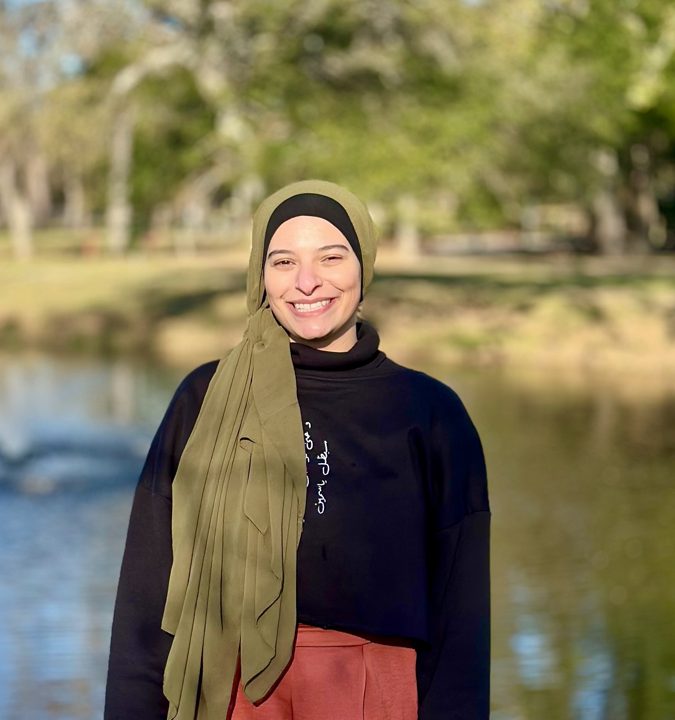 Malak Baker, small business operations and automation consultant, smiling outdoors